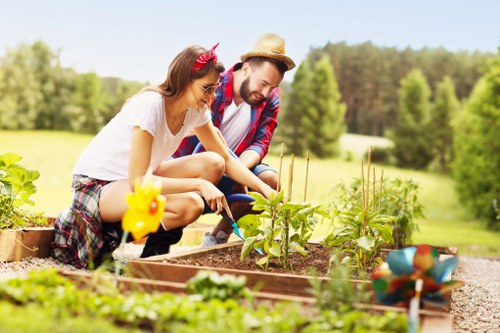 Crew preparing green waste at a garden clearance to be separated for recycling